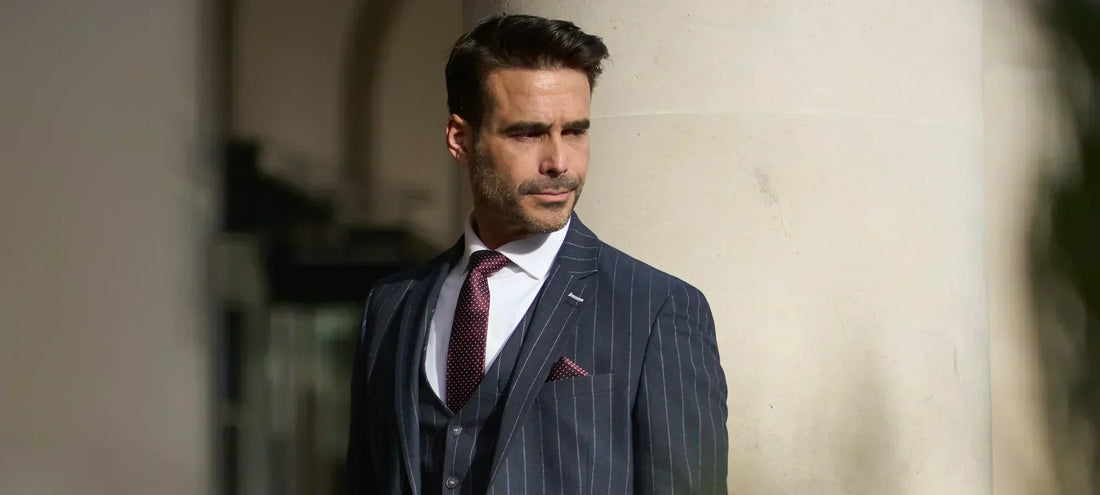 Gentleman in outside in a Cavani suit with leather travel bag